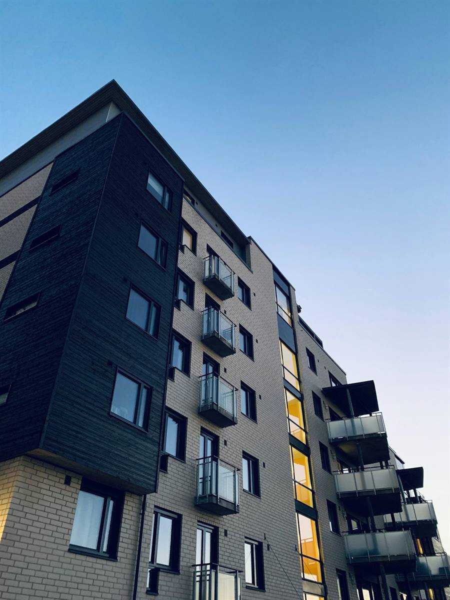 A contemporary apartment building at dusk